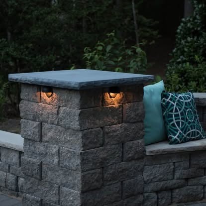 Stacked stone pillar with low-voltage cap lights and outdoor bench seating